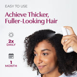 Achieve thicker, fuller-looking hair with woman applying BosleyMD product.