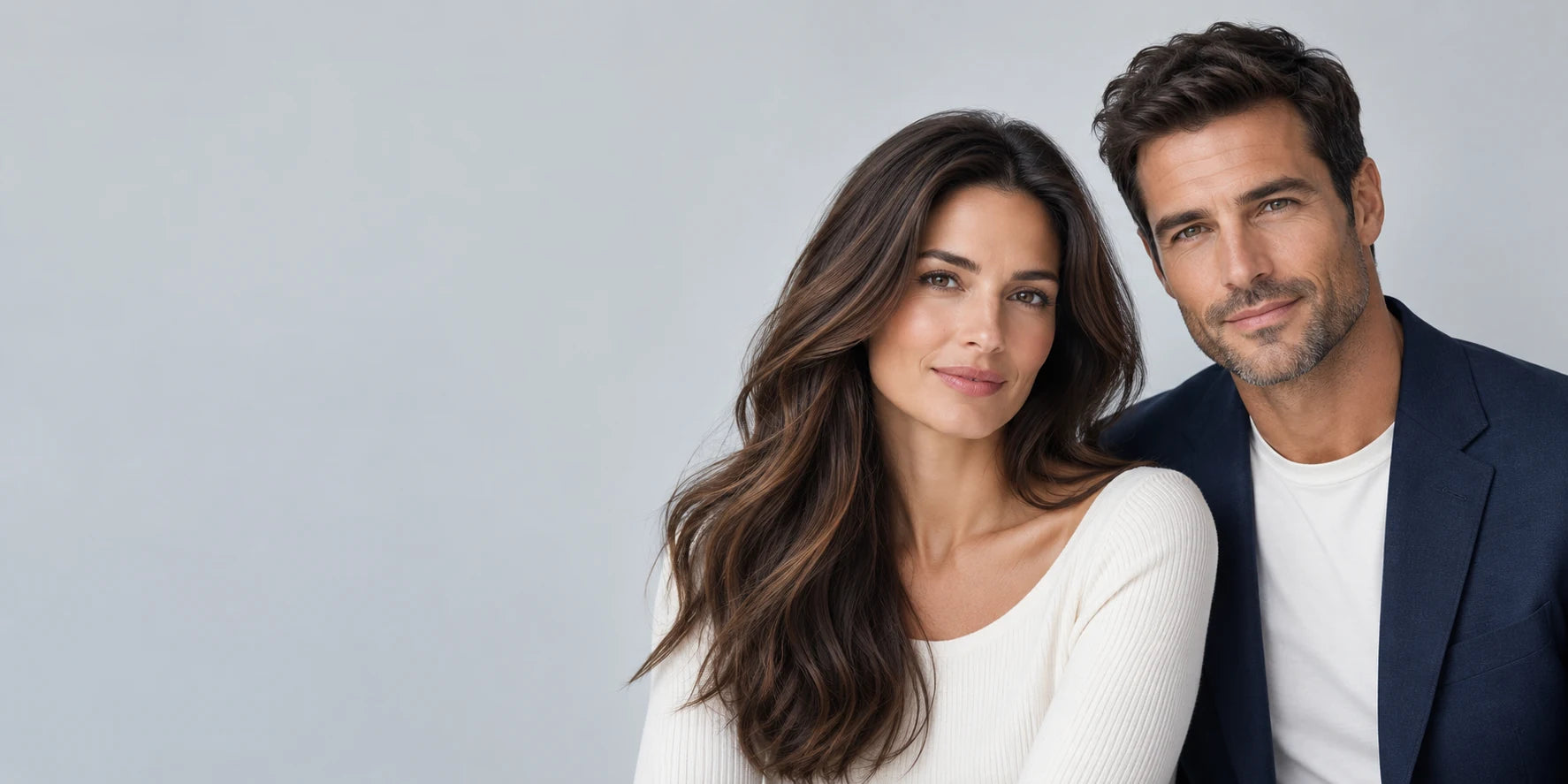 A woman with long brunette hair and a man with short textured hair in a BosleyMD campaign portrait